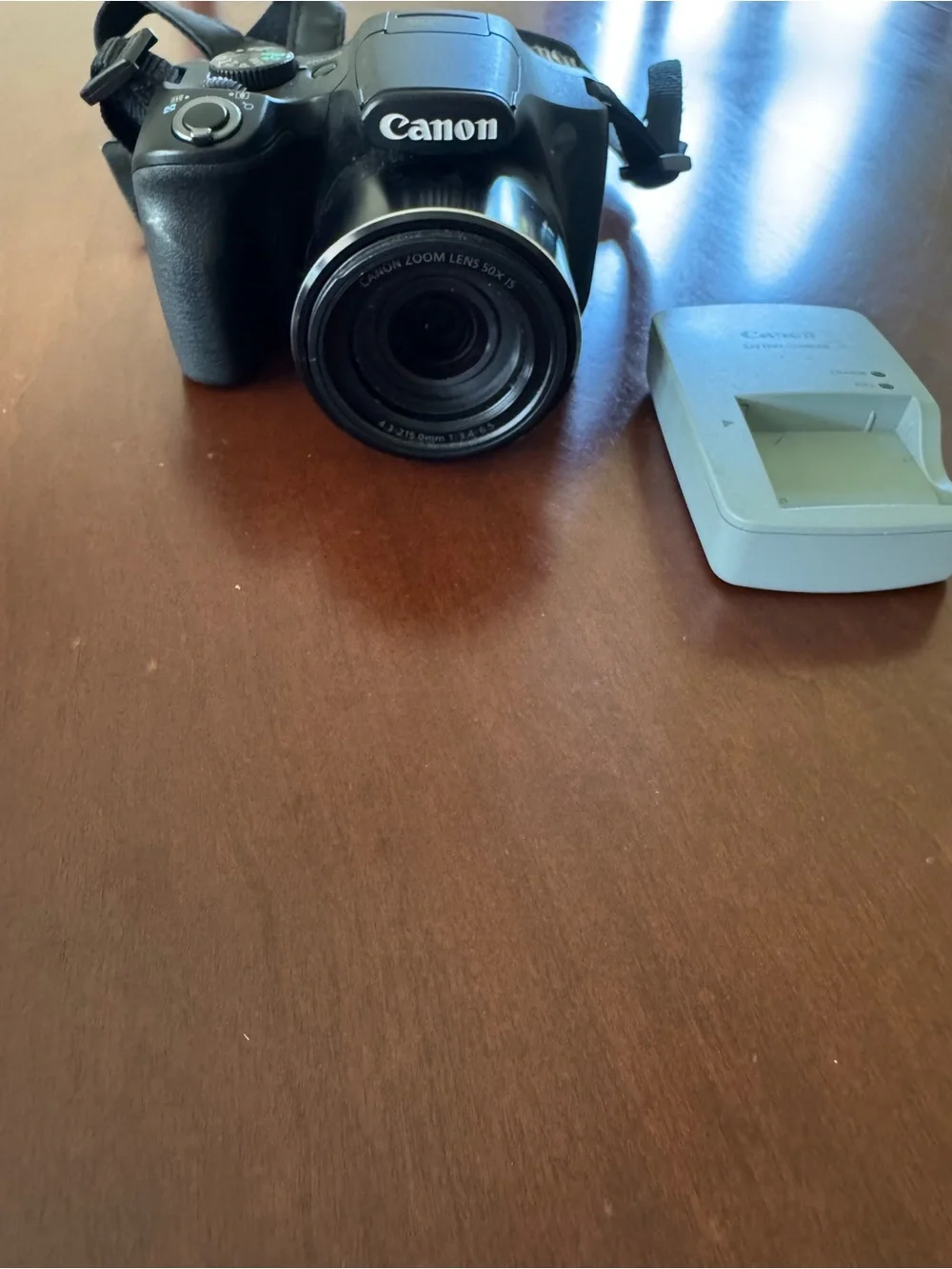 Canon Black Digital Bridge Camera with White Battery Charger